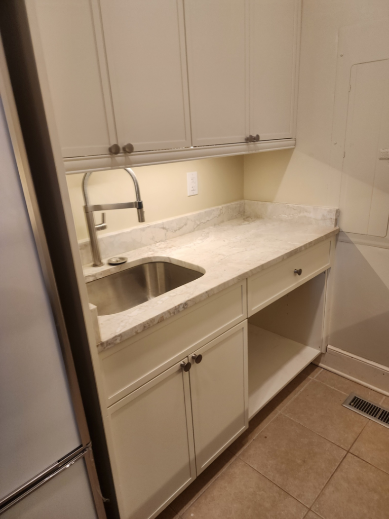 Under-cabinet lighting and electrical outlet installed in a kitchen by D&R Construction & Electrical Services in Summerville, SC.