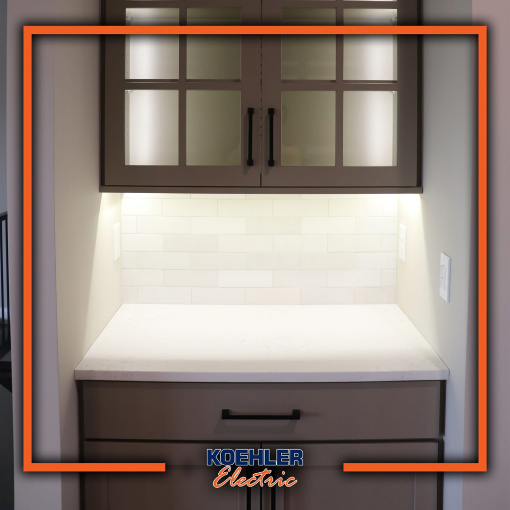 Under-cabinet lighting and electrical outlets installed in a kitchenette by Koehler Electric in Davenport, IA.