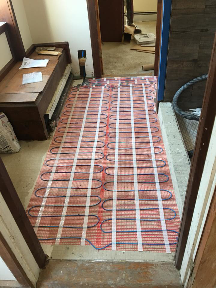An underfloor heating mat being installed, a service provided by ELSI Electric LLC in Rockville, MD.