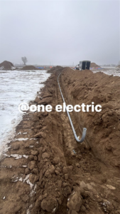 Underground conduit installation at a construction site by One Electric LLC in Idaho Falls, ID