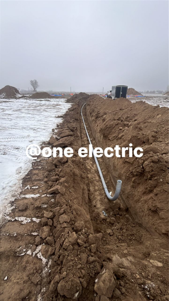 Underground conduit installation at a construction site by One Electric LLC in Idaho Falls, ID