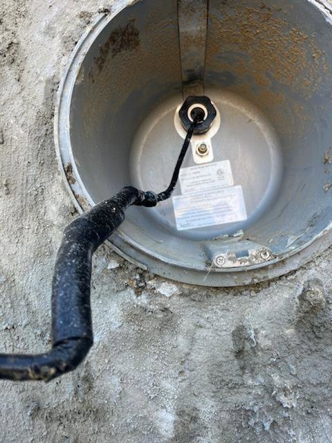 Close-up of an underground electrical conduit connection being worked on by Common Ground Electrical in Baltimore, MD.
