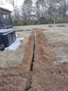 Underground electrical conduit laid in a trench for hot tub installation by Devin Parker Electric in Knoxville, TN