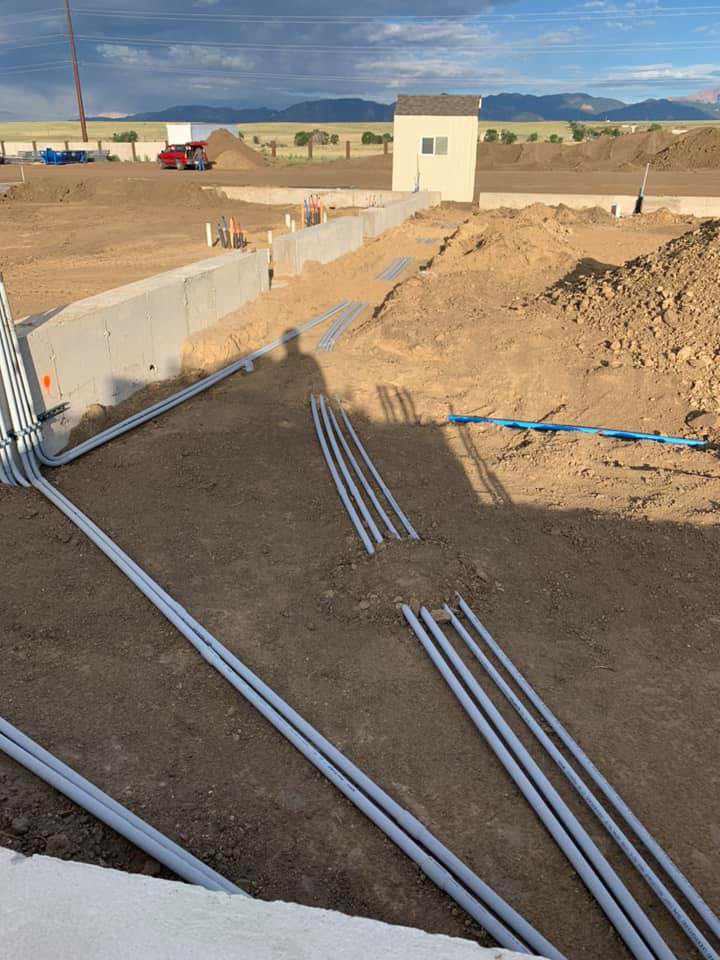 Underground electrical conduit installation on a construction site by GDS Electric Inc. in Colorado Springs, CO