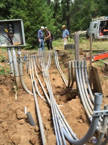 Underground electrical conduit and wiring installation in a trench by Johnsen Electric Inc in Springfield, OR.