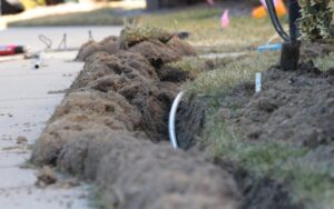 A close-up view of an underground electrical conduit being installed by Relay Electric, LLC in Suffolk, VA.