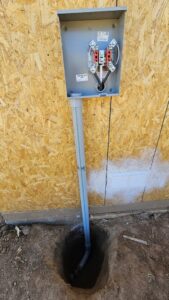 Underground electrical conduit entering a meter base on a new construction wall by V Electrical LLC in Albuquerque, NM.