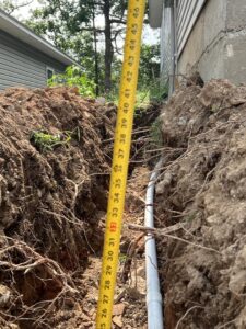Underground electrical conduit trenching for new wiring by Nelson Electric, Inc. in Hot Springs, AR.
