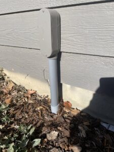 Underground electrical conduit installation leading to an outdoor electrical box by Wilson Electrical Contractors in Orlando, FL.