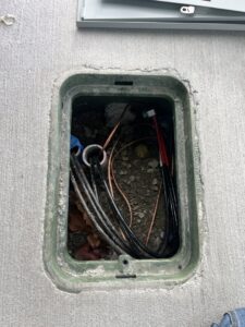 Underground electrical connections and wiring in an open utility box, serviced by Peeler Electric Light & Power in Merrimack, NH.
