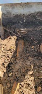 An underground pipe exposed during excavation by Call The Doc Air Doctor Heating, Air Conditioning and Plumbing in Richardson, TX.