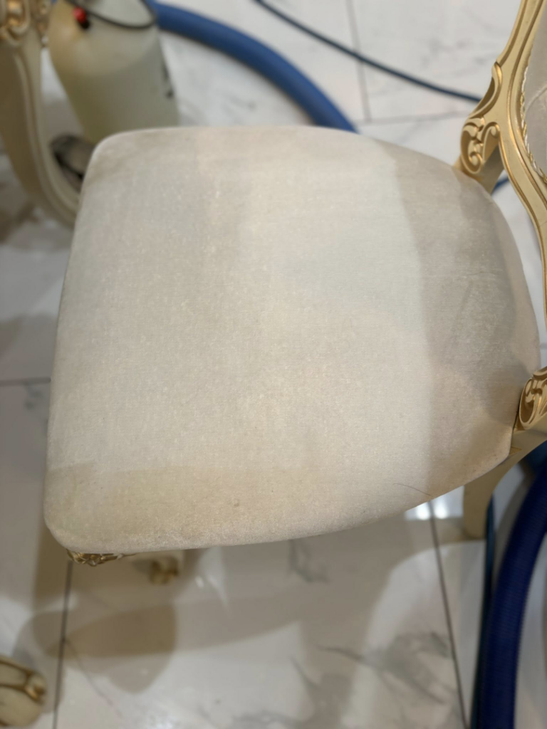 An upholstered chair being professionally cleaned by White Diamond Carpet Cleaners in Baton Rouge, LA.