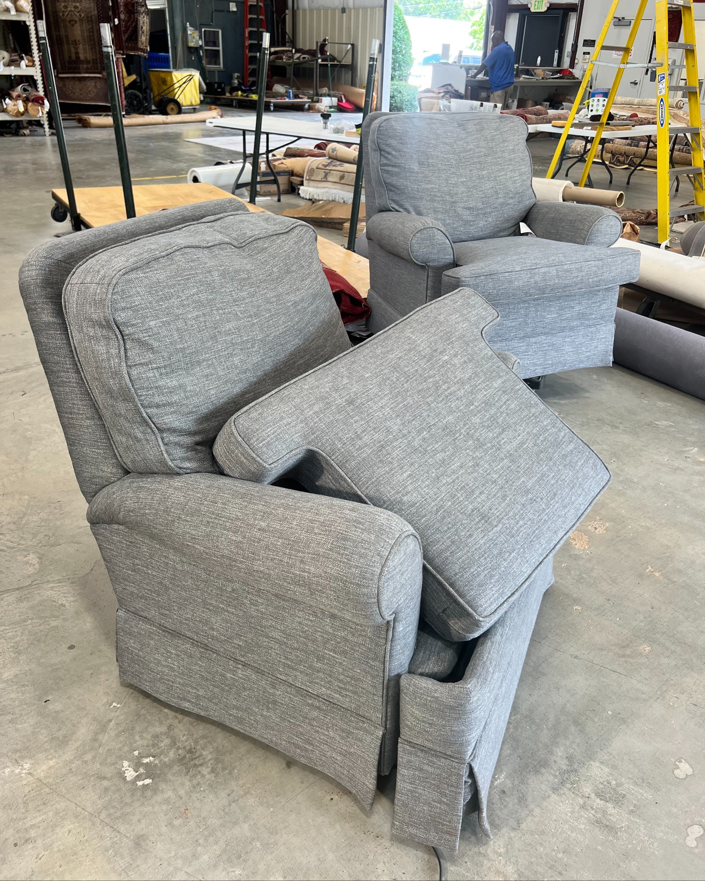 Upholstered chairs and carpet rolls in the workshop of Sanitary Rug Cleaners, Inc. in Birmingham, AL.