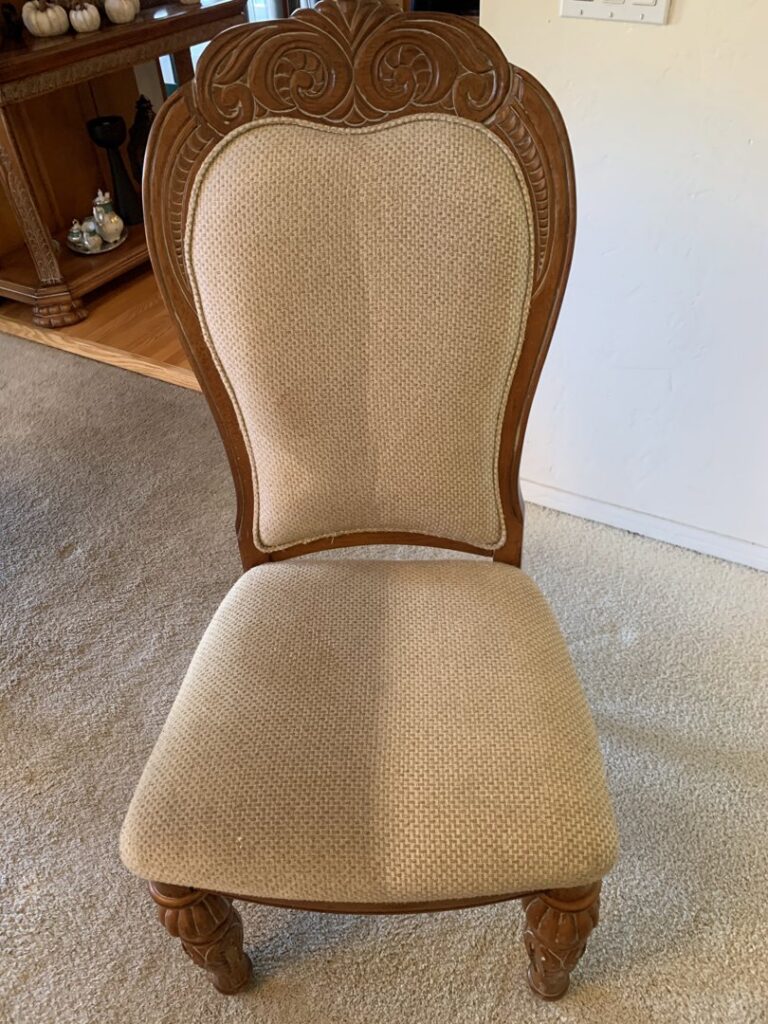 An upholstered dining chair showing a clear before and after cleaning by JS Carpet Cleaning in San Jose, CA