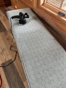 Upholstery bench cleaning in progress by Treo General Services of North Carolina LLC in Durham, NC.