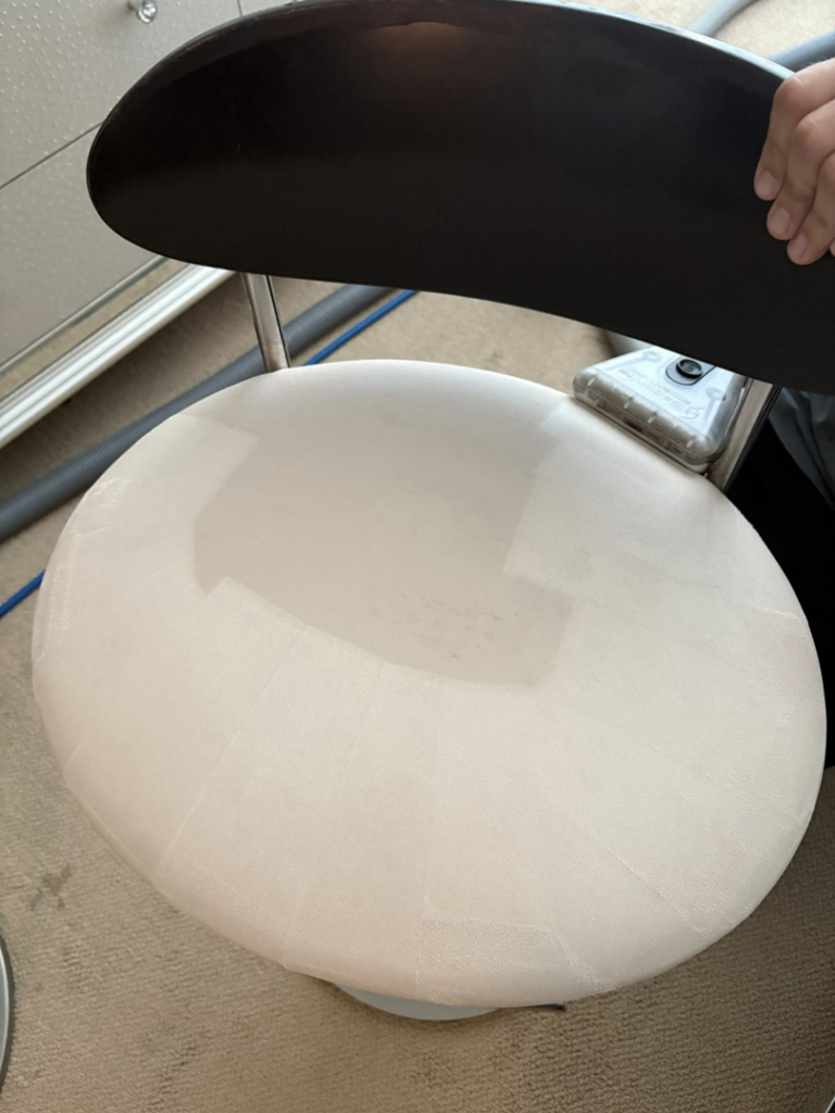 Professional upholstery cleaning of a chair seat by Carpet Chemistry in Gulfport, MS.