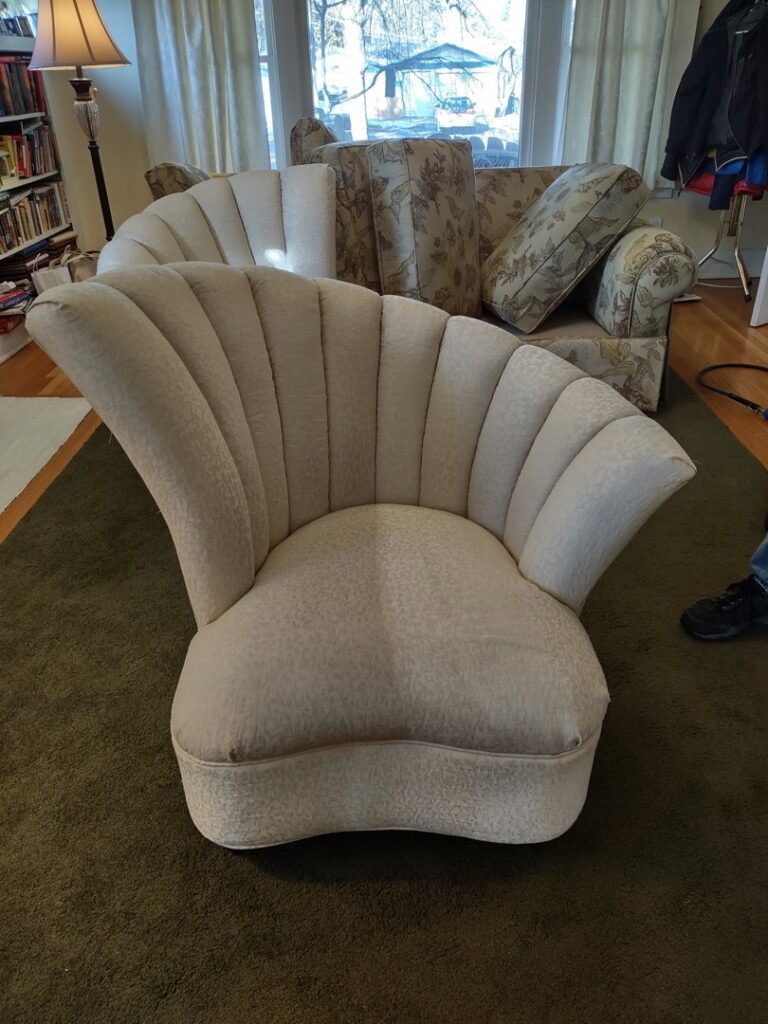Upholstery cleaning in progress on a decorative chair, showing a clean section by Clean-Master in Coeur d'Alene, ID.