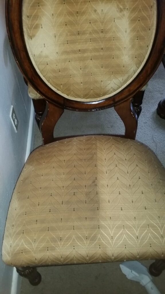Upholstery cleaning in progress on a chair, part of services by BareFoot Clean, Inc. in Virginia Beach, VA.