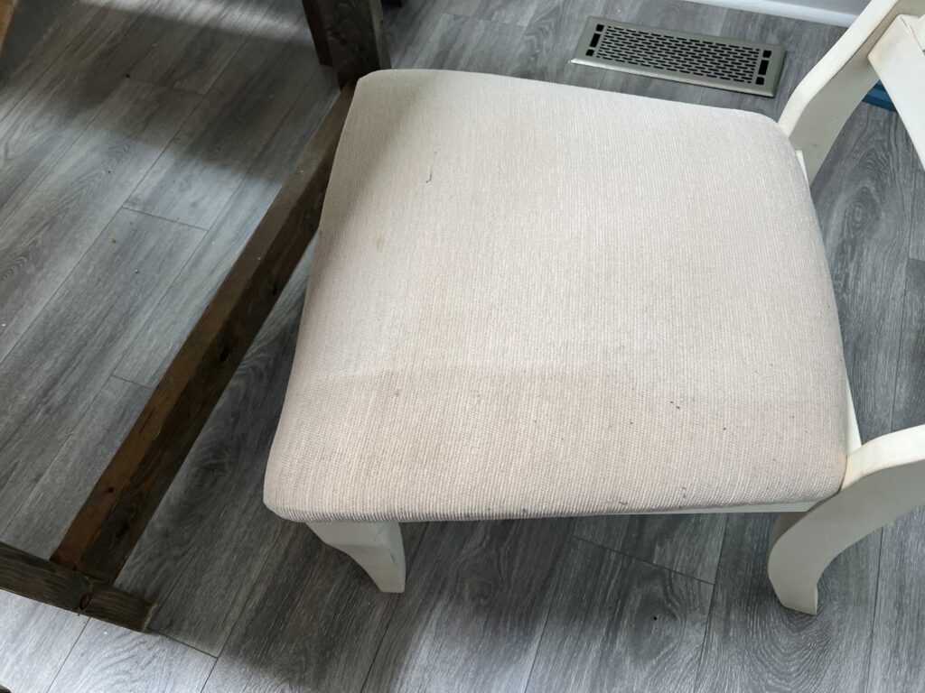 An upholstered chair showing a clean section after professional cleaning by The Ultimate Floor Care Services in Hilton Head Island, SC