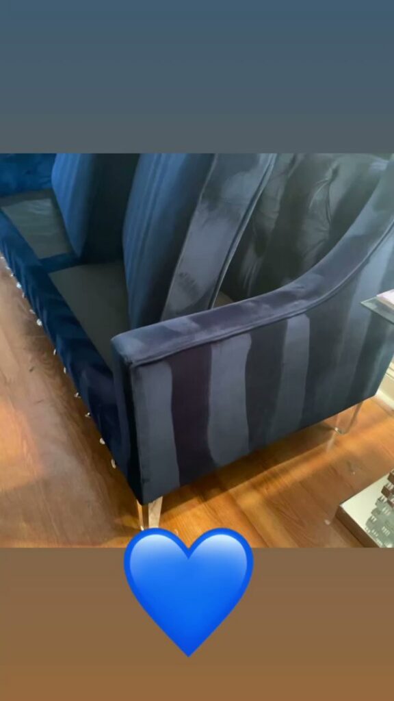 A blue sofa undergoing professional upholstery cleaning, showing fresh cleaning lines from Iclean Indy in Indianapolis, IN.