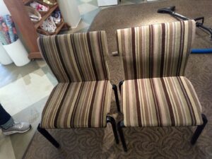 Two striped upholstered chairs on a carpet, indicating upholstery cleaning services by Carpet Masters of Albuquerque, NM.