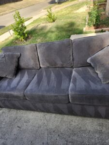 A sofa showing clear cleaning lines from upholstery cleaning by 5 Sons Carpet Cleaning in Dallas, TX