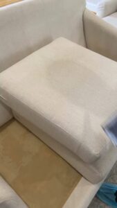 A sofa cushion showing before and after results of upholstery cleaning by Tmz Magic Carpet Cleaning in West Hartford, CT.