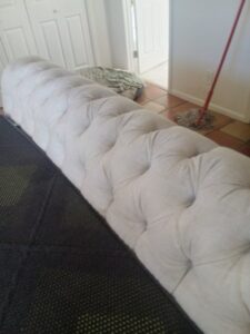 Professional upholstery cleaning of a long, tufted bench or sofa by Carpets Dirty in Phoenix, AZ