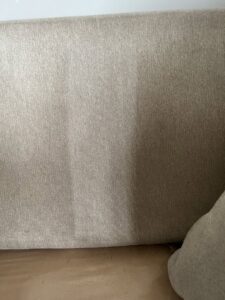 A couch backrest showing a clear before and after of upholstery cleaning by Brooke's Chem-Dry Lawrence in Kansas City, MO.