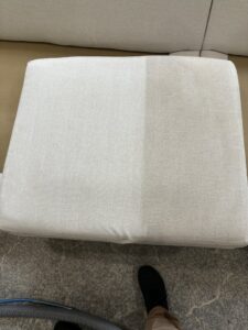 An upholstery cushion showing a clear before and after difference from cleaning by Veterans Chem-Dry Music City in Nashville, TN.