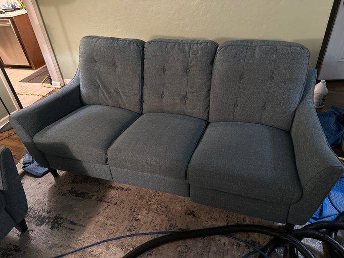 Upholstery and rug cleaning setup with hoses on an area rug by Anderson Certified, INC. in Chicago, IL.