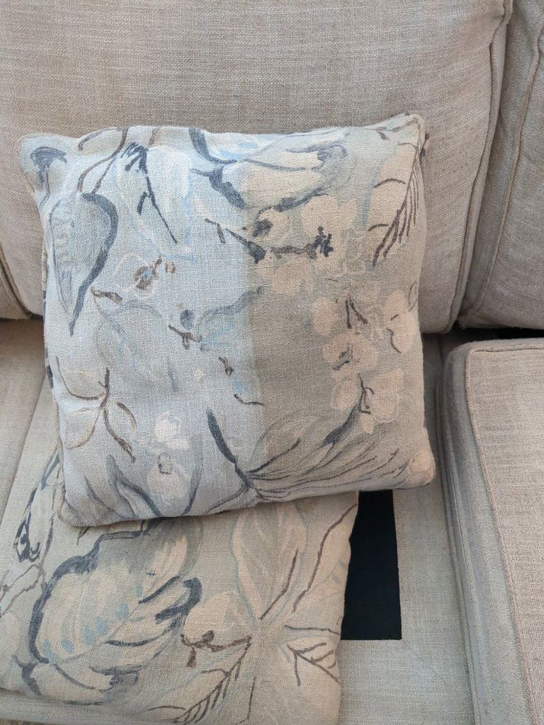 Before and after view of a sofa arm after upholstery cleaning by American Pure Clean, LLC in Charleston, SC