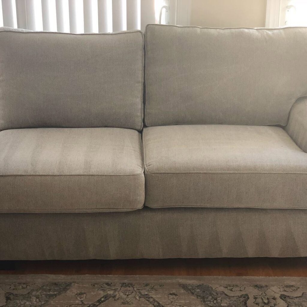 A freshly cleaned sofa with visible cleaning lines by First Response Custom Cleaning in Newport News, VA