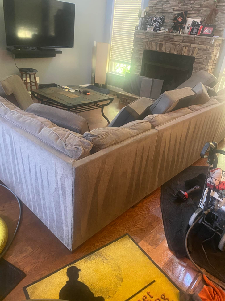 Professional upholstery sofa cleaning in progress, showing clean lines, by DCSfloorcleaning in Charlotte, NC
