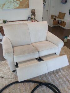 Upholstery sofa with visible cleaning lines after service by American Pure Clean, LLC in Charleston, SC