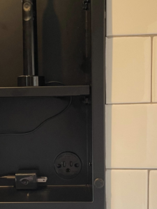 A modern electrical outlet with USB ports installed inside a cabinet by Richard A. Gibbons in Dracut, MA.