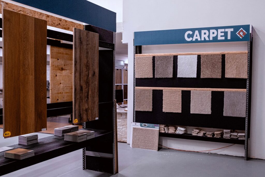 A showroom display featuring various carpet samples for selection at Central Floors Wholesaler in Rockville, MD