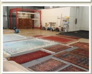 Cleaned rugs laid out for drying and inspection in the professional facility of Rub A Dub Rug in Las Vegas, NV.