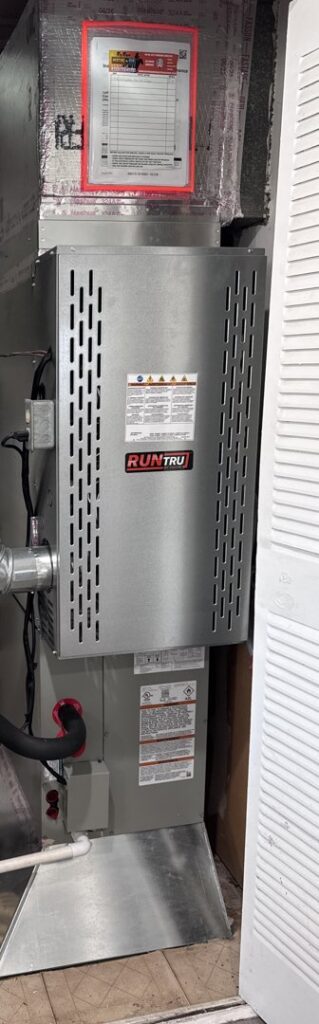 A vertical HVAC air handler unit with ductwork installed by Roy Rogers Heating and Air in Indianapolis, IN.
