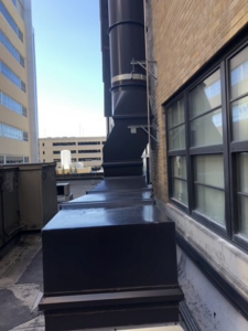 Vertical HVAC ductwork installation extending up the side of a building by Kuhlmann Supply Company in Earth City, MO