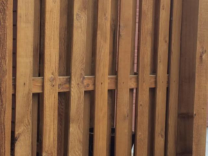 Detailed view of a vertical slat wood fence, showcasing quality craftsmanship by Colorado Fence and Gate Systems in Colorado Springs, CO.