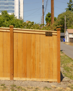 A sturdy vertical wood privacy fence with a top rail, expertly installed by Alpine Fencing in Everett, WA.