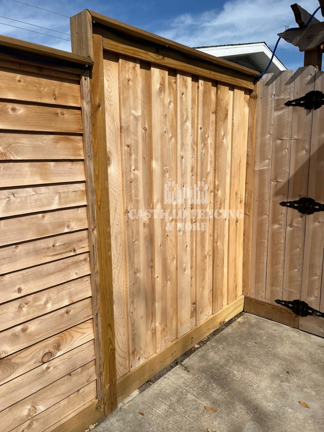A new vertical wood privacy fence and gate installed by Castillo Fencing & More in Corpus Christi, TX.