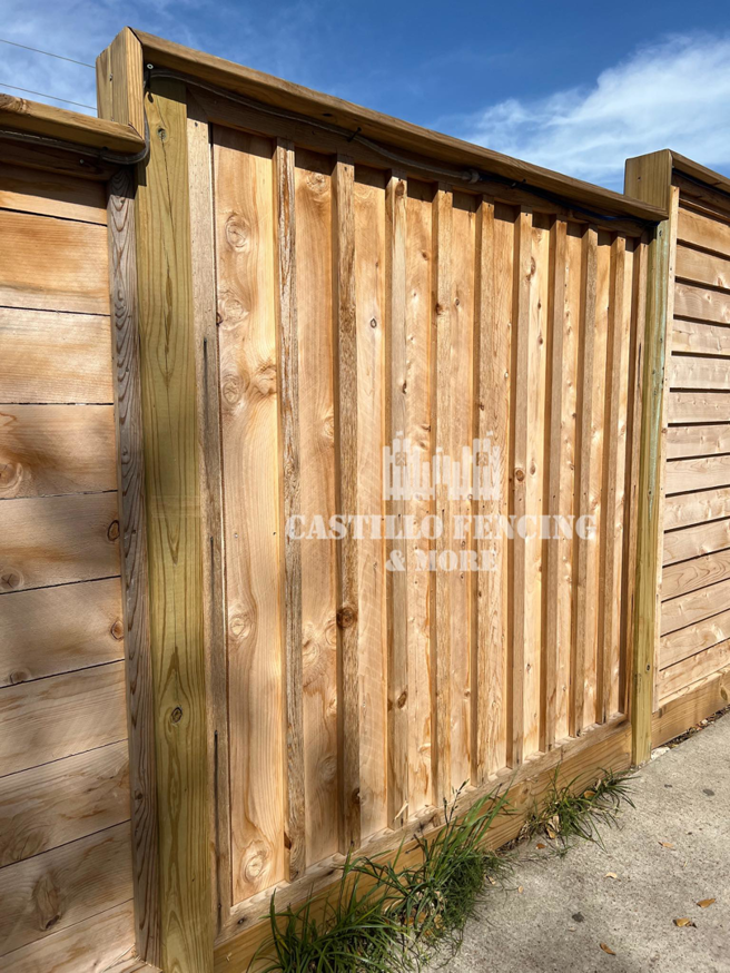 A newly built vertical wood privacy fence section by Castillo Fencing & More in Corpus Christi, TX.