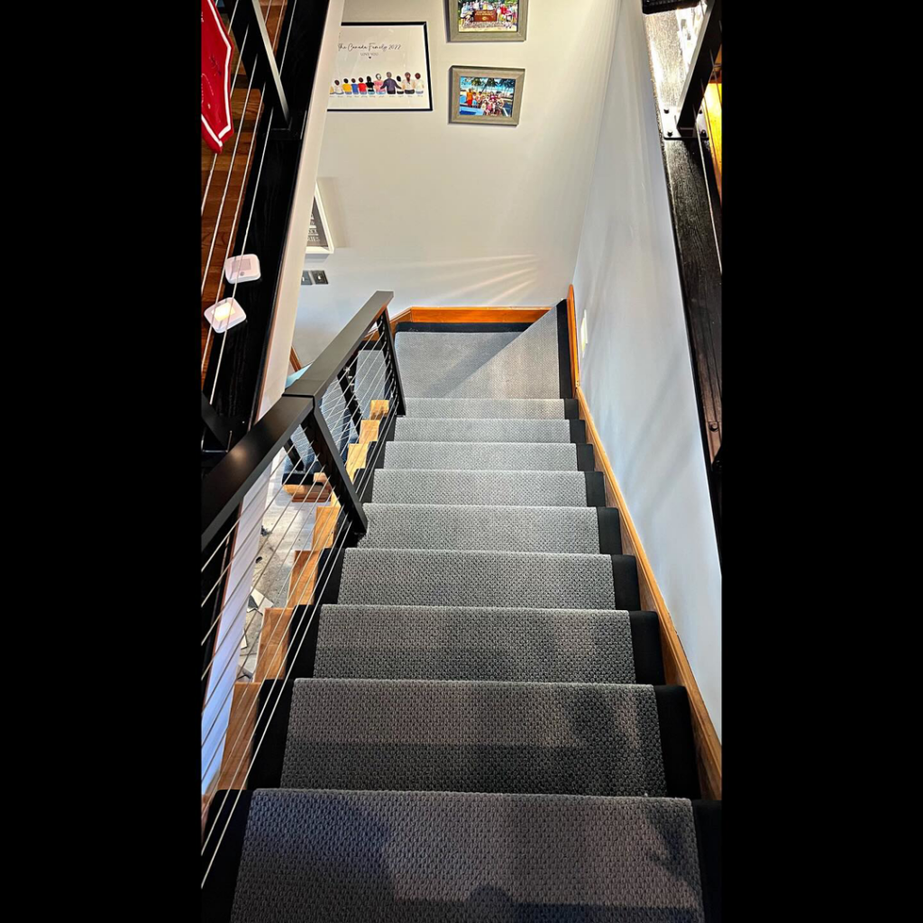 A top-down view of a newly carpeted staircase by Z Flooring in Noblesville, IN