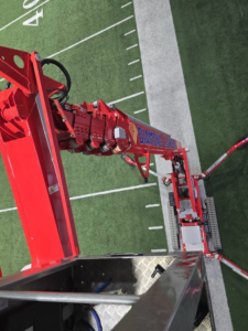A view from the basket of a Diamond Lighting & Maintenance boom lift, showing equipment used for high-reach electrical work in Sheridan, IL.