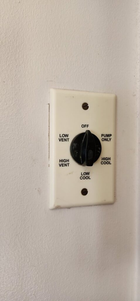 A vintage HVAC control panel with settings for vent and cool by Utah Mechanical Heating and Air Conditioning in South Ogden, UT.
