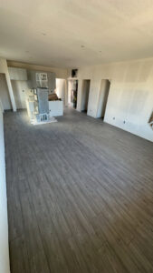 A walk-in closet with a fresh carpet installation completed by H&J Brothers Ltd in Colorado Springs, CO.