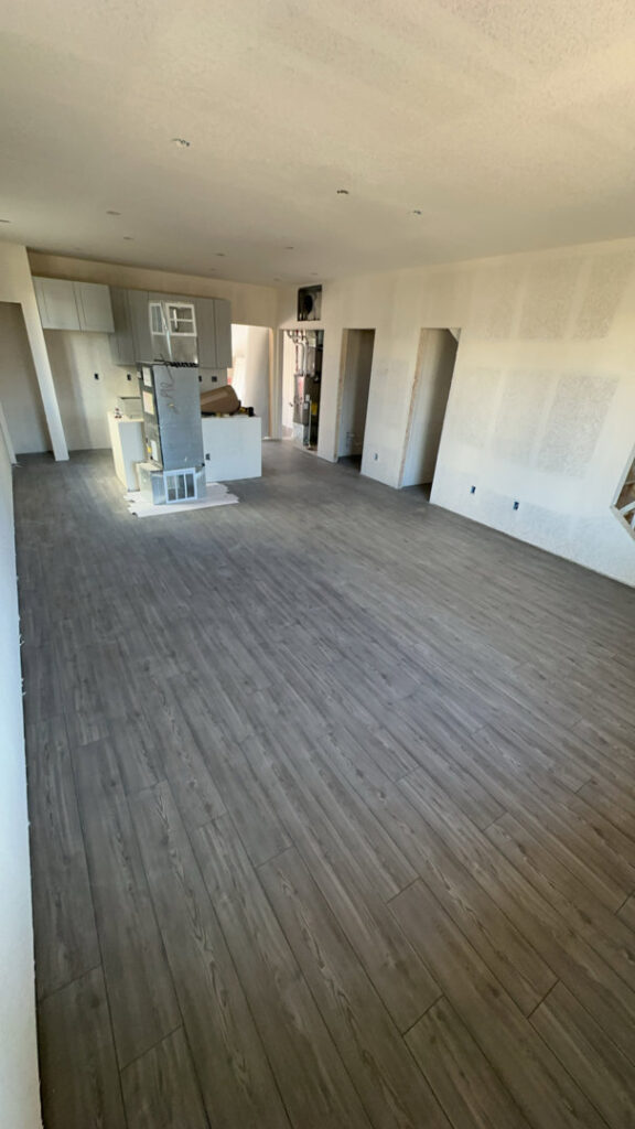 A walk-in closet with a fresh carpet installation completed by H&J Brothers Ltd in Colorado Springs, CO.