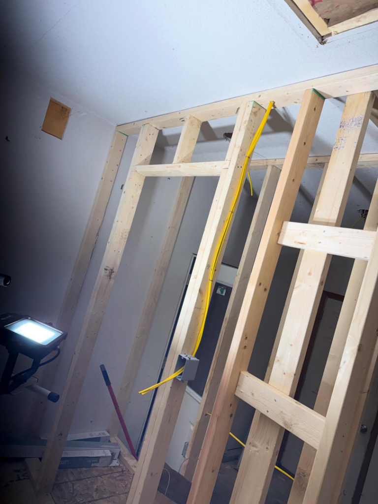 Wall electrical wiring rough-in with yellow cable and an electrical box by J's Electrical & Maintenance Services, LLC in Columbus, OH.